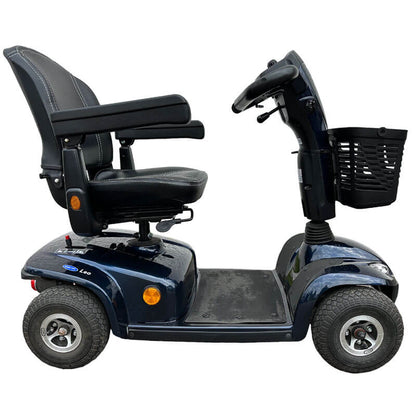 The Invacare Leo Mobility Scooter is a reliable and convenient premium shopping scooter, offering a 23-mile range with 36ah batteries and large pneumatic tyres for stability. It features ample storage, splash protection, an adjustable delta tiller, and front and rear lights.The 4-wheel Leo provides a smooth ride with automatic headlights, self-cancelling indicators, and a rear brake light for added safety.