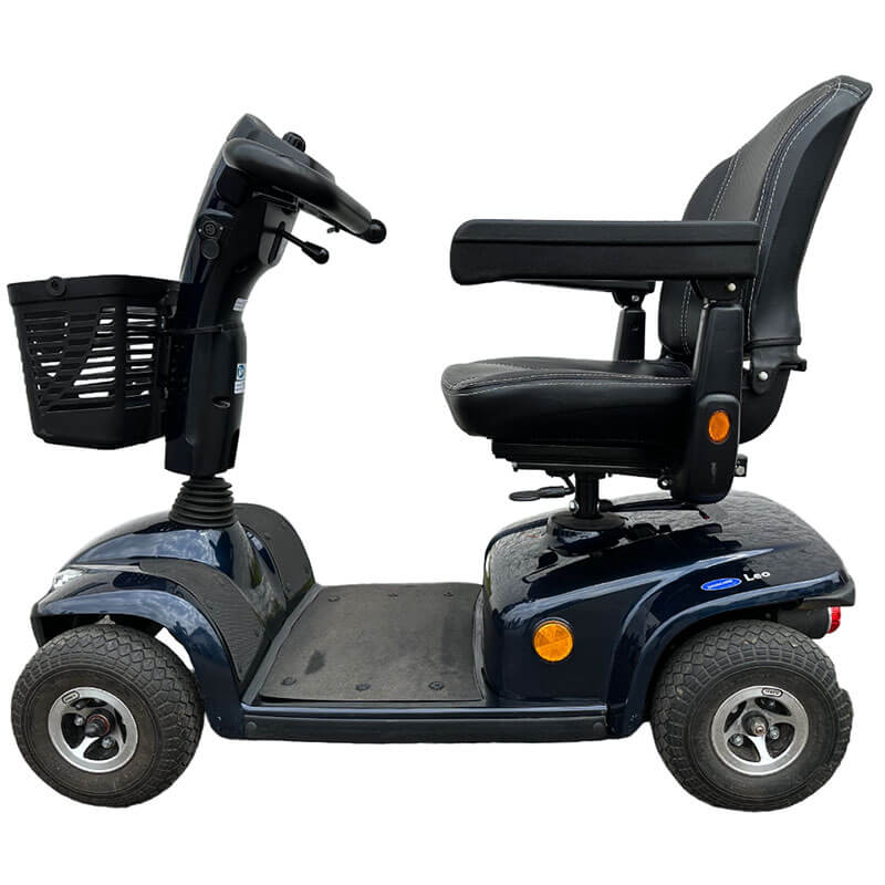 The Invacare Leo Mobility Scooter is a reliable and convenient premium shopping scooter, offering a 23-mile range with 36ah batteries and large pneumatic tyres for stability. It features ample storage, splash protection, an adjustable delta tiller, and front and rear lights.The 4-wheel Leo provides a smooth ride with automatic headlights, self-cancelling indicators, and a rear brake light for added safety.